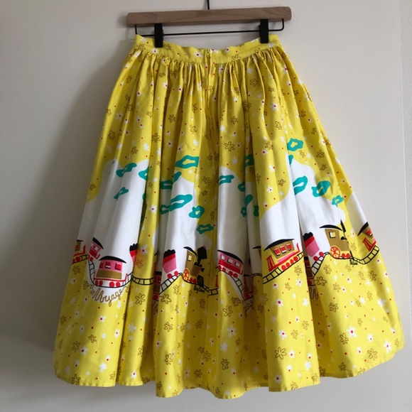 Pinup Couture Jenny Skirt in Mary Blair "Bon Voyage" Yellow Train Print, Small - Picture 3 of 10